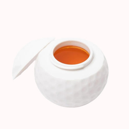 Kreativt shotglas formet som en golfbold